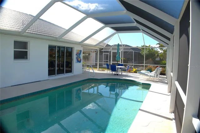 a view of a patio with a table and chairs