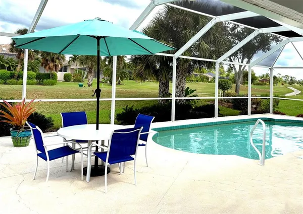 a view of a swimming pool with a patio