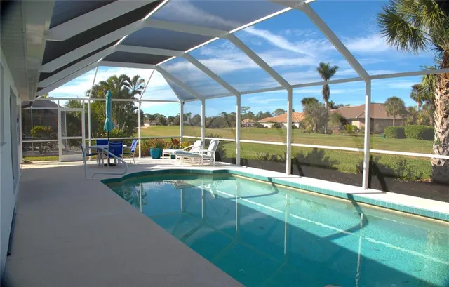 a view of a patio with table and chairs