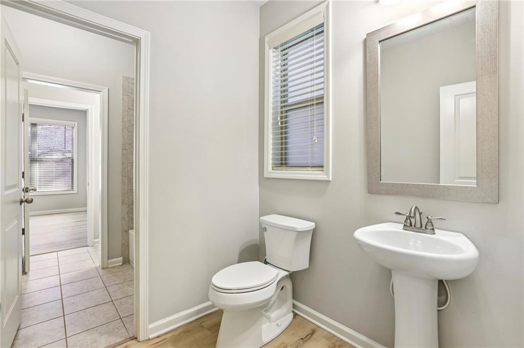 1210 Roswell Manor Circle Roswell, GA 30076 - Photo 17 of 43 a bathroom with a sink toilet and shower