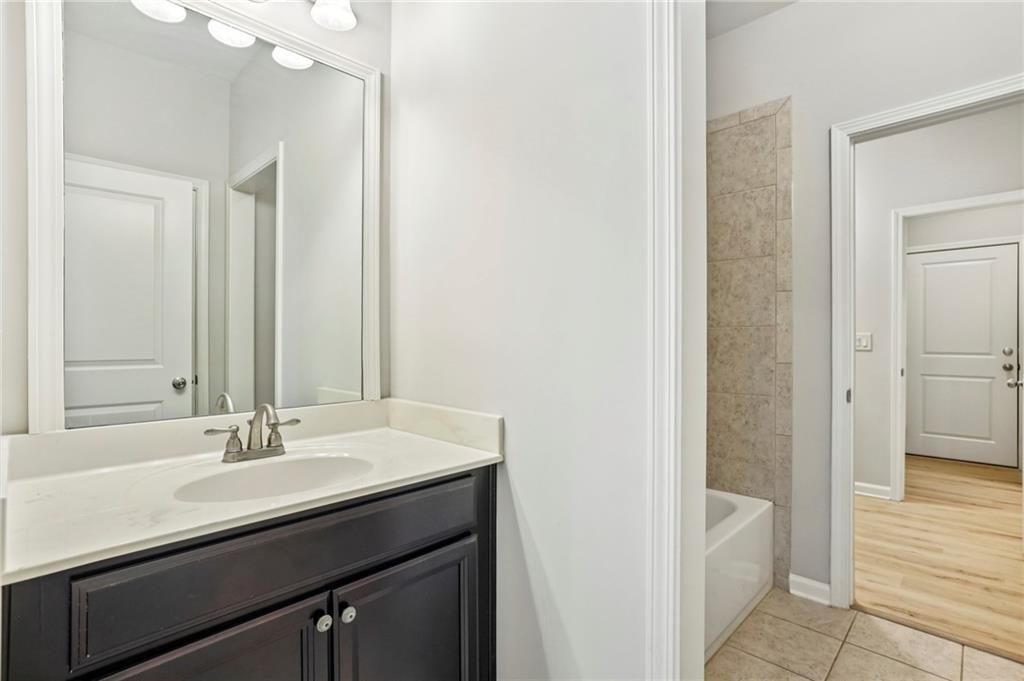1210 Roswell Manor Circle Roswell, GA 30076 - Photo 18 of 43 a bathroom with a sink and a mirror