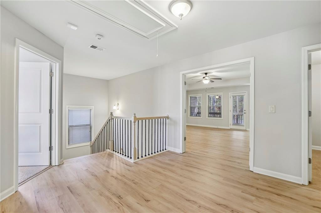 1210 Roswell Manor Circle Roswell, GA 30076 - Photo 20 of 43 a view of a room with wooden floor and a bathroom