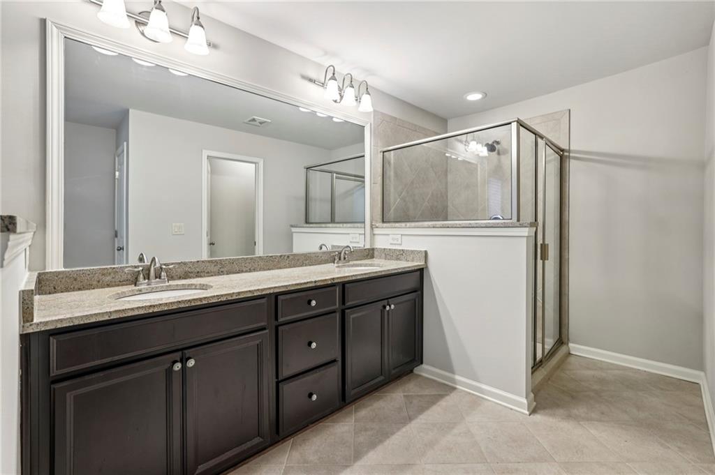 1210 Roswell Manor Circle Roswell, GA 30076 - Photo 26 of 43 a bathroom with a double vanity sink mirror and double