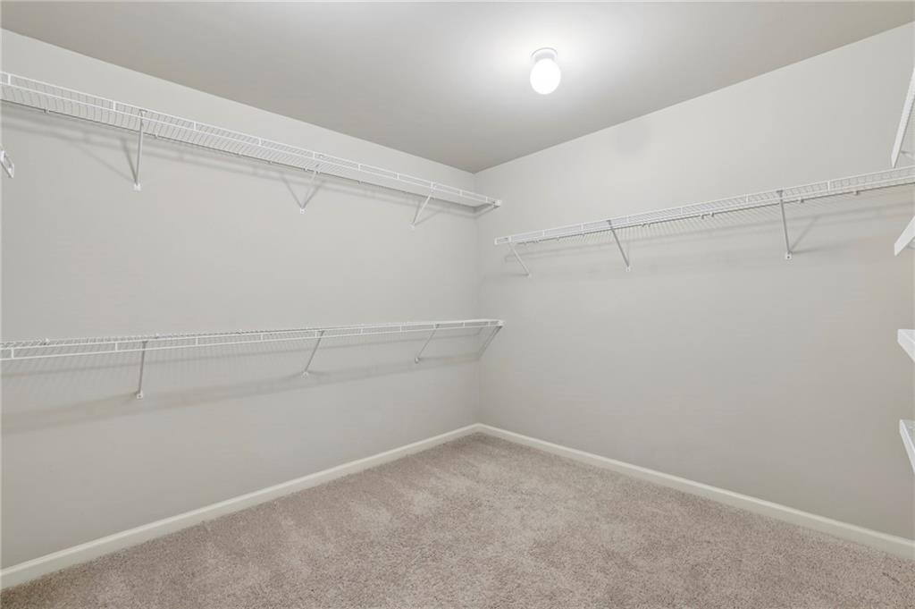 1210 Roswell Manor Circle Roswell, GA 30076 - Photo 28 of 43 a view of a room with racks on the wall