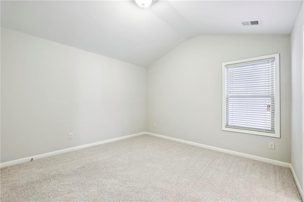 1210 Roswell Manor Circle Roswell, GA 30076 - Photo 31 of 43 an empty room with a window