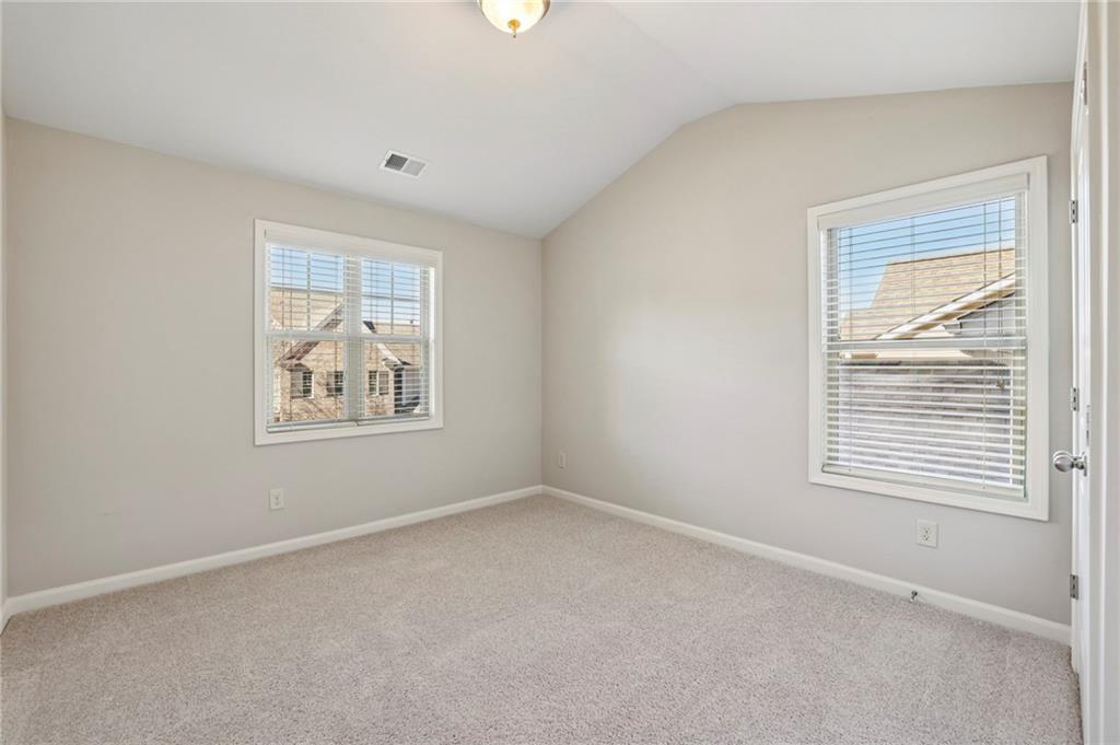 1210 Roswell Manor Circle Roswell, GA 30076 - Photo 34 of 43 an empty room with windows