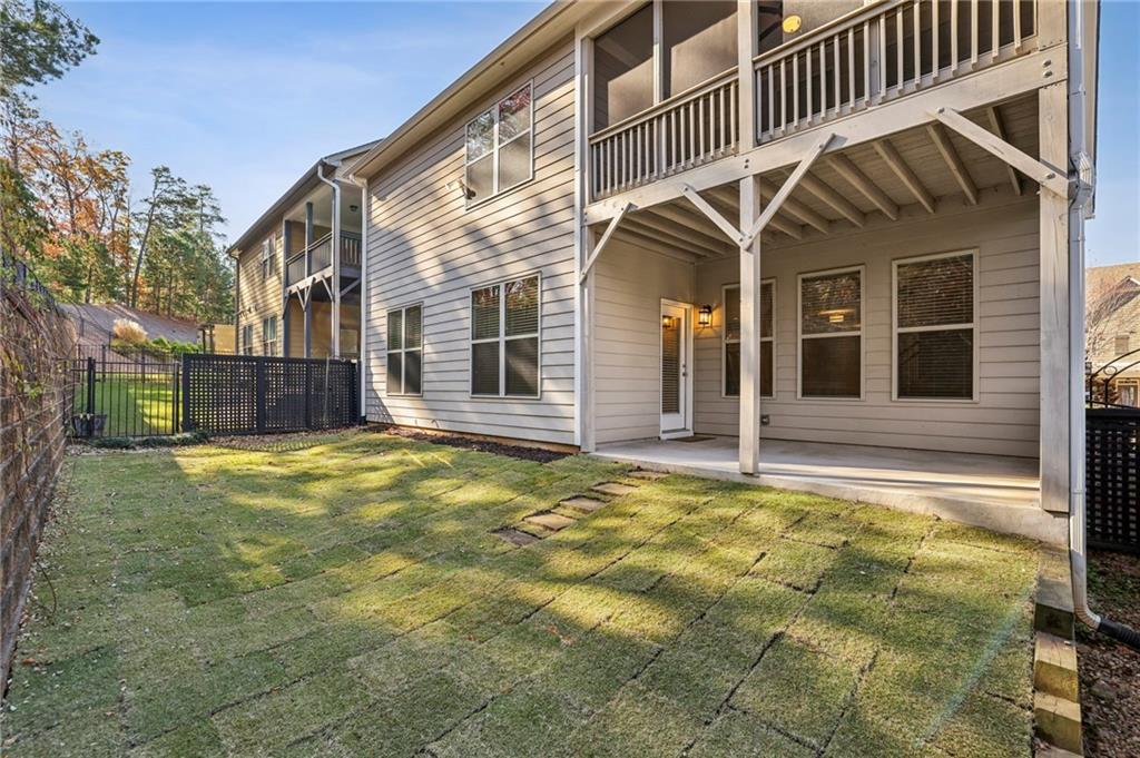 1210 Roswell Manor Circle Roswell, GA 30076 - Photo 38 of 43 a view of a house with a swimming pool