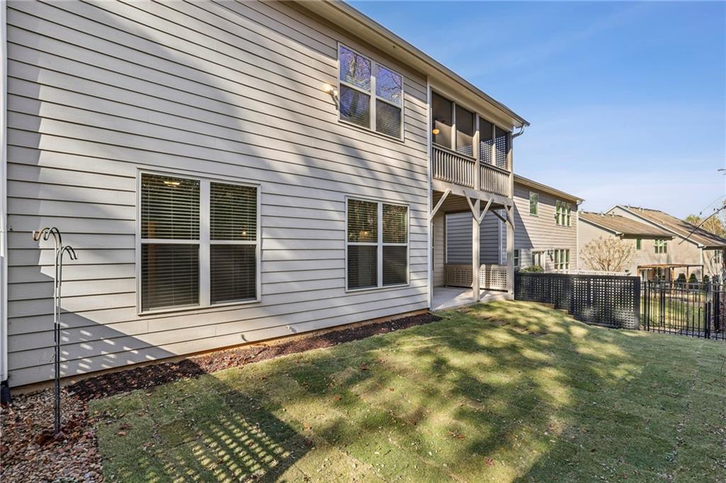 1210 Roswell Manor Circle Roswell, GA 30076 - Photo 39 of 43 a front view of a house with a garage