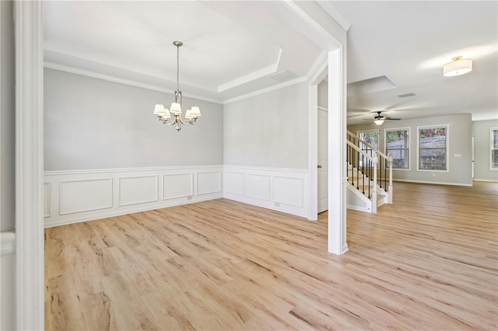 1210 Roswell Manor Circle Roswell, GA 30076 - Photo 4 of 43 a view of empty room with wooden floor