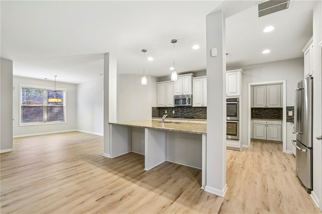 1210 Roswell Manor Circle Roswell, GA 30076 - Photo 8 of 43 a view of kitchen with cabinets appliances and wooden floor