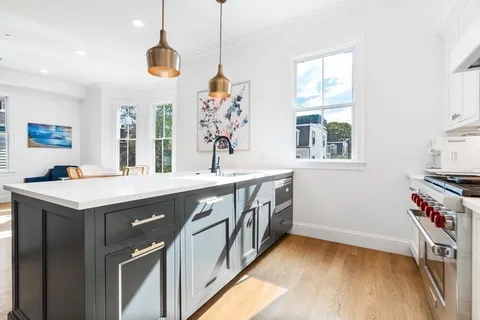 a kitchen with a stove and a refrigerator