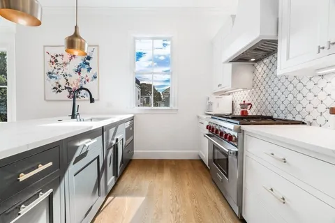 a dining room with furniture window wooden floor
