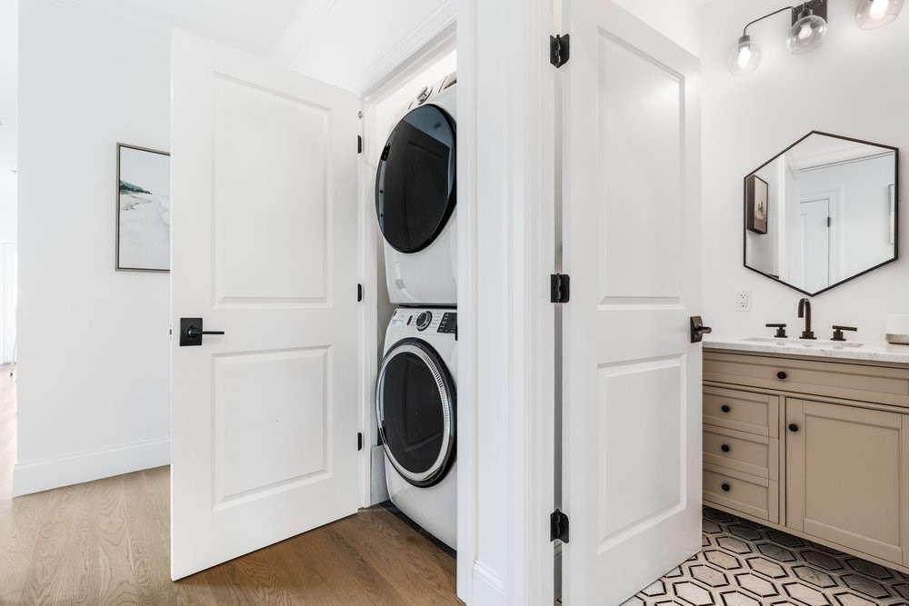 560 East 5th Street, Unit 2 Boston, MA 02127 - Photo 19 of 27 a view of a hallway with washer and dryer