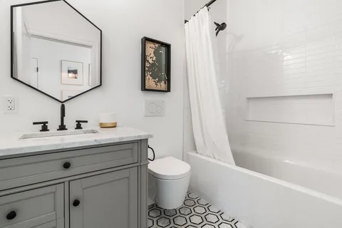 front view of a house with a bench