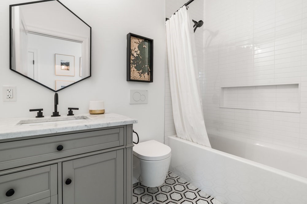 560 East 5th Street, Unit 2 Boston, MA 02127 - Photo 21 of 27 a bathroom with a sink a toilet and shower