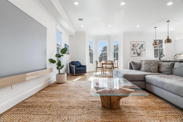 a living room with furniture and a rug