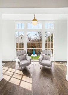 a kitchen with stainless steel appliances granite countertop a kitchen island a stove a table and chairs