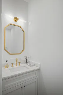 a spacious bedroom with a bed table and window