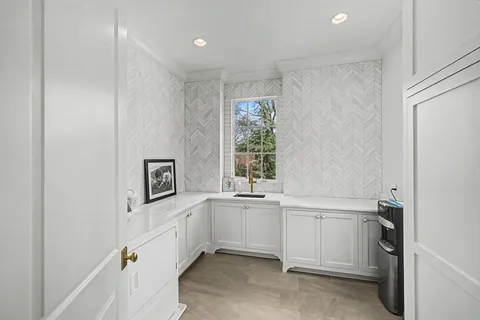 a bathroom with a granite countertop sink a toilet and shower