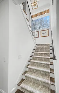 a bathroom with a sink mirror and shower