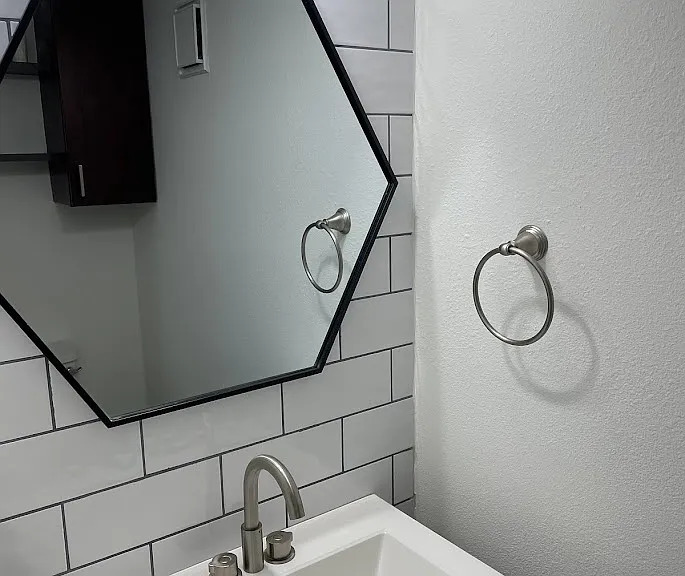 2018 West Rundberg Lane, Unit 16C Austin, TX 78758 - Photo 2 of 12 a bathroom with a sink and a mirror