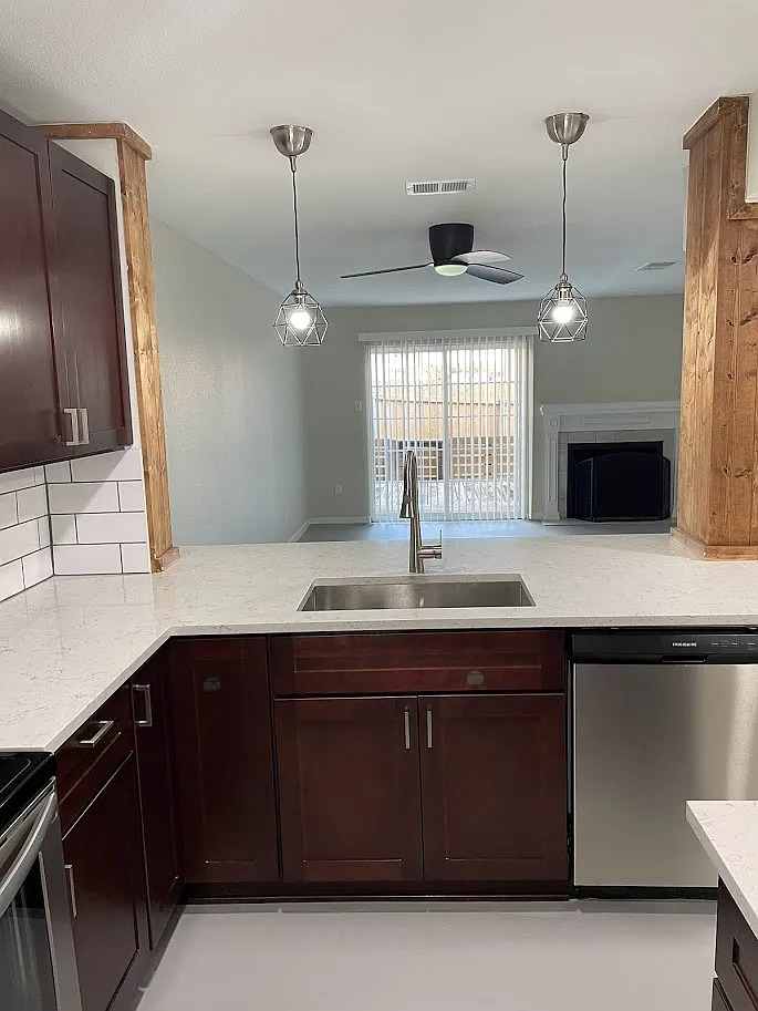 2018 West Rundberg Lane, Unit 16C Austin, TX 78758 - Photo 5 of 12 a kitchen with a sink and a refrigerator