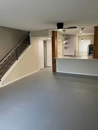 a view of a hallway with stairs