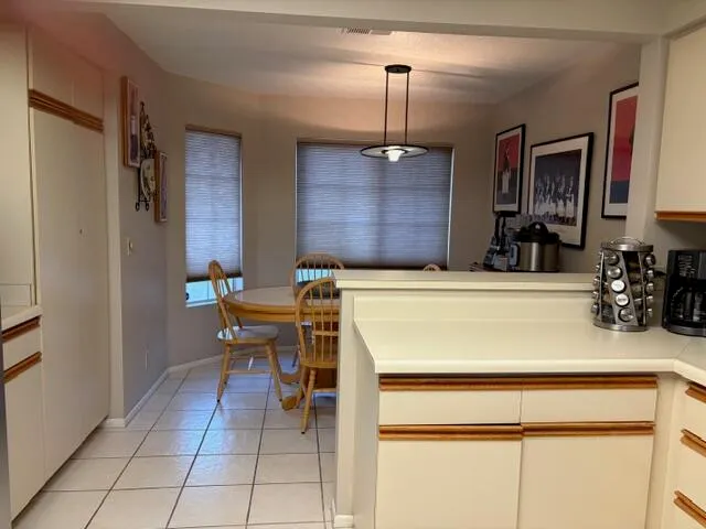 a kitchen with a sink and a refrigerator