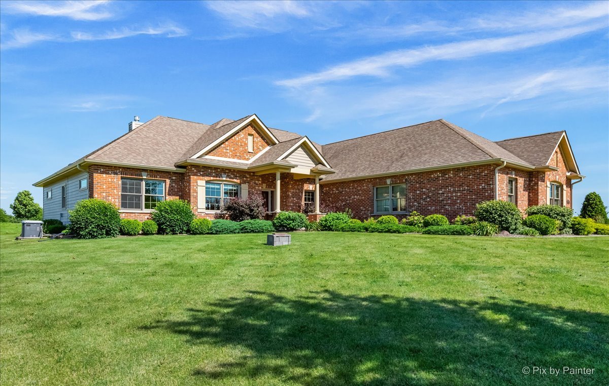 7306 Bob-O-Link Road Spring Grove, IL 60081 - Photo 6 of 14 a front view of a house with a yard