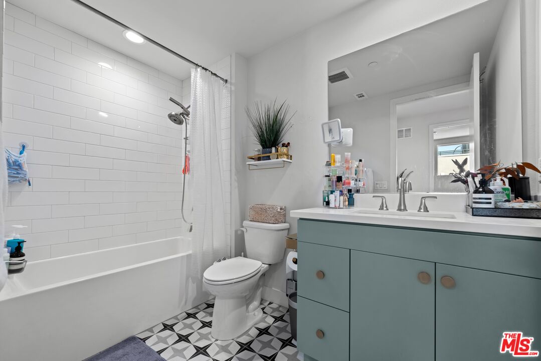 4326 Eagle Rock Boulevard Los Angeles, CA 90041 - Photo 17 of 33 a bathroom with a sink a toilet and shower