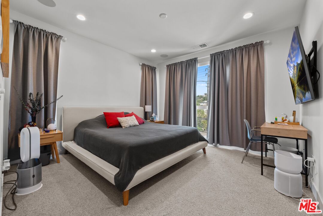 4326 Eagle Rock Boulevard Los Angeles, CA 90041 - Photo 20 of 33 a bedroom with a bed and a flat screen tv