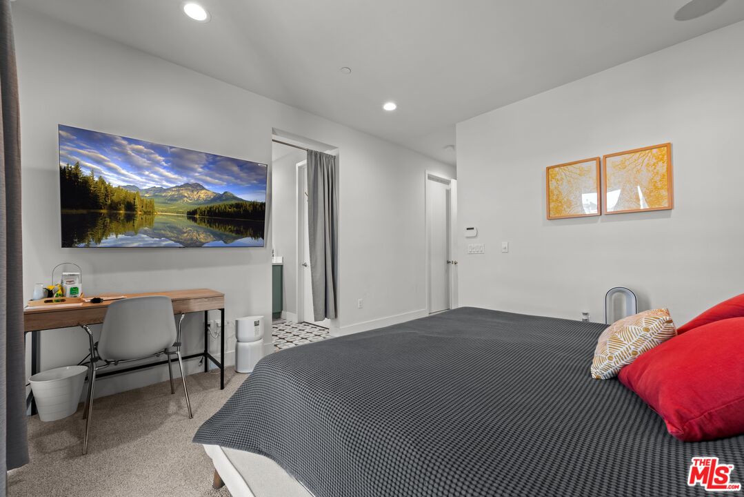 4326 Eagle Rock Boulevard Los Angeles, CA 90041 - Photo 22 of 33 a bedroom with a bed and a flat screen tv