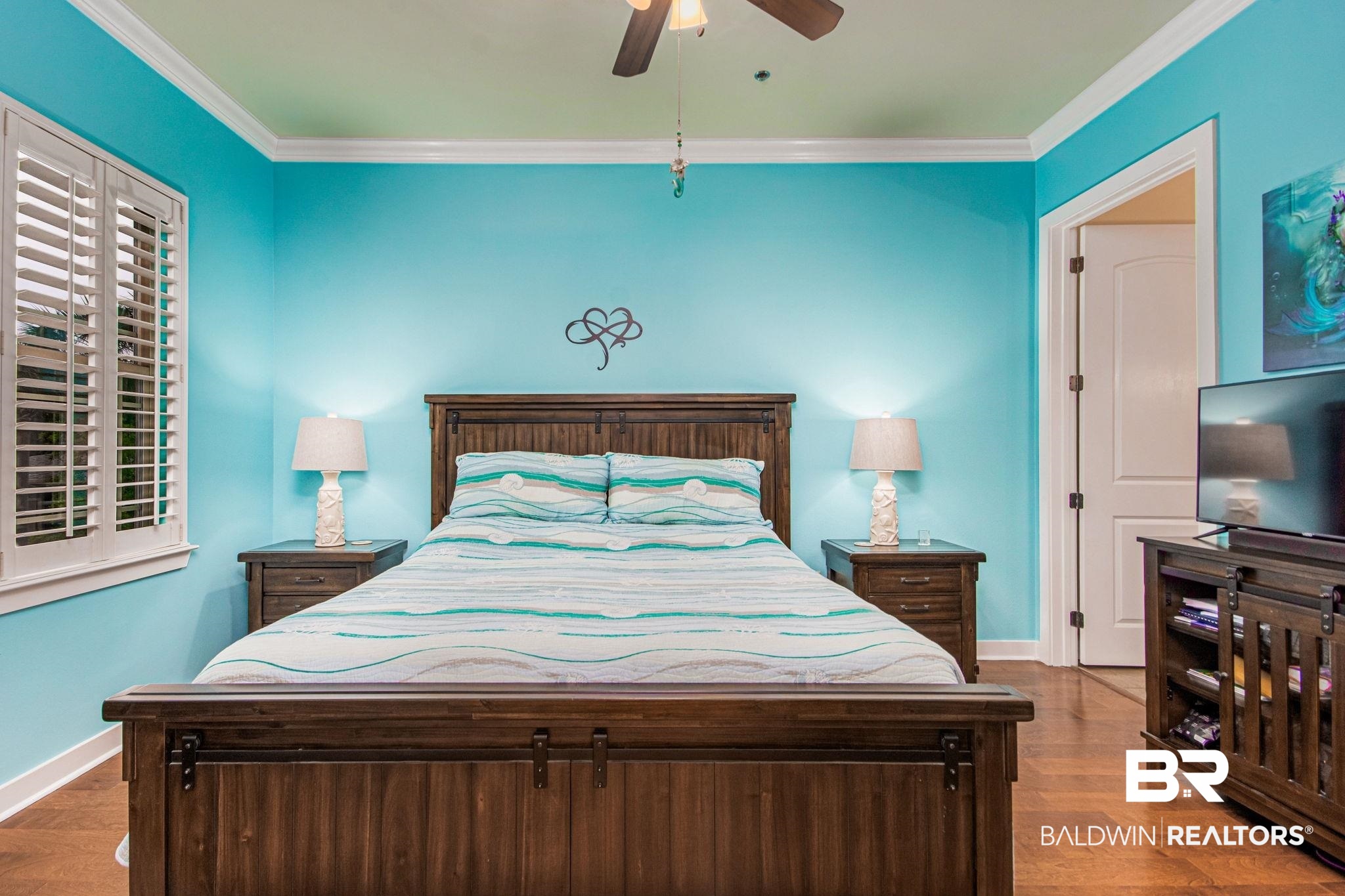 1430 Regency Road, Unit I201 Gulf Shores, AL 36542 - Photo 15 of 34 Bedroom featuring crown molding, dark wood-type flooring, and ceiling fan