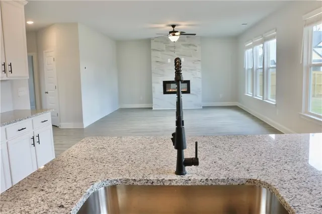 a view of a kitchen sink and natural light
