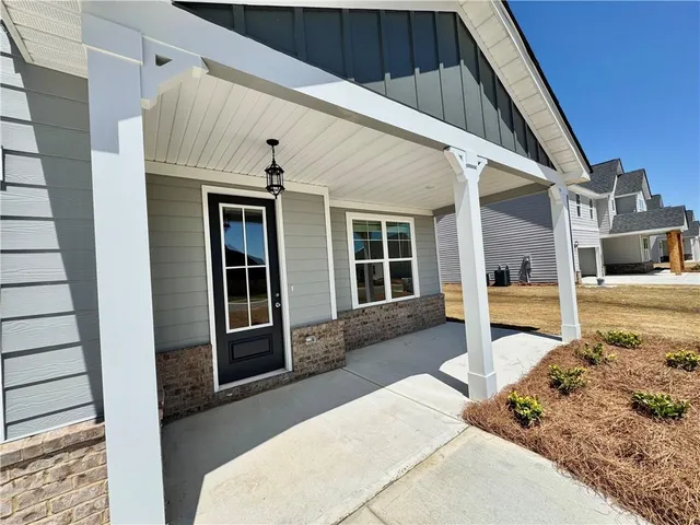 a front view of a house with a outdoor space