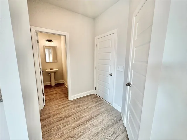 a view of a bathroom from a hallway