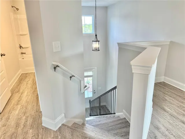 a view of a hallway view with staircase