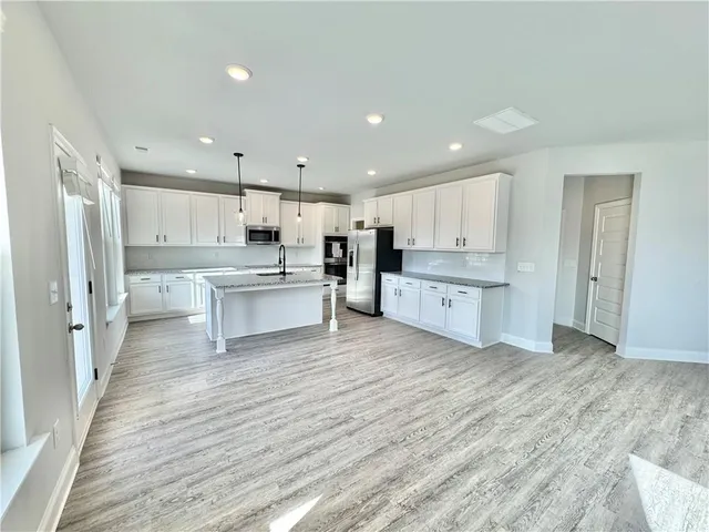 a view of kitchen with wooden floor