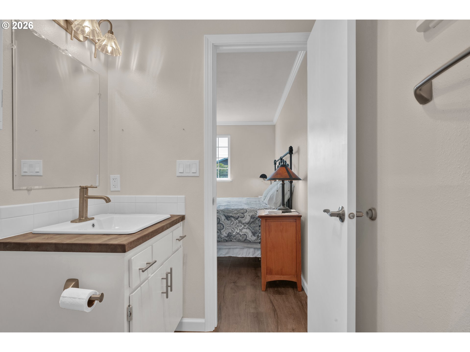 1142 9th Street Florence, OR 97439 - Photo 22 of 41 a bathroom with a sink vanity toilet and shower