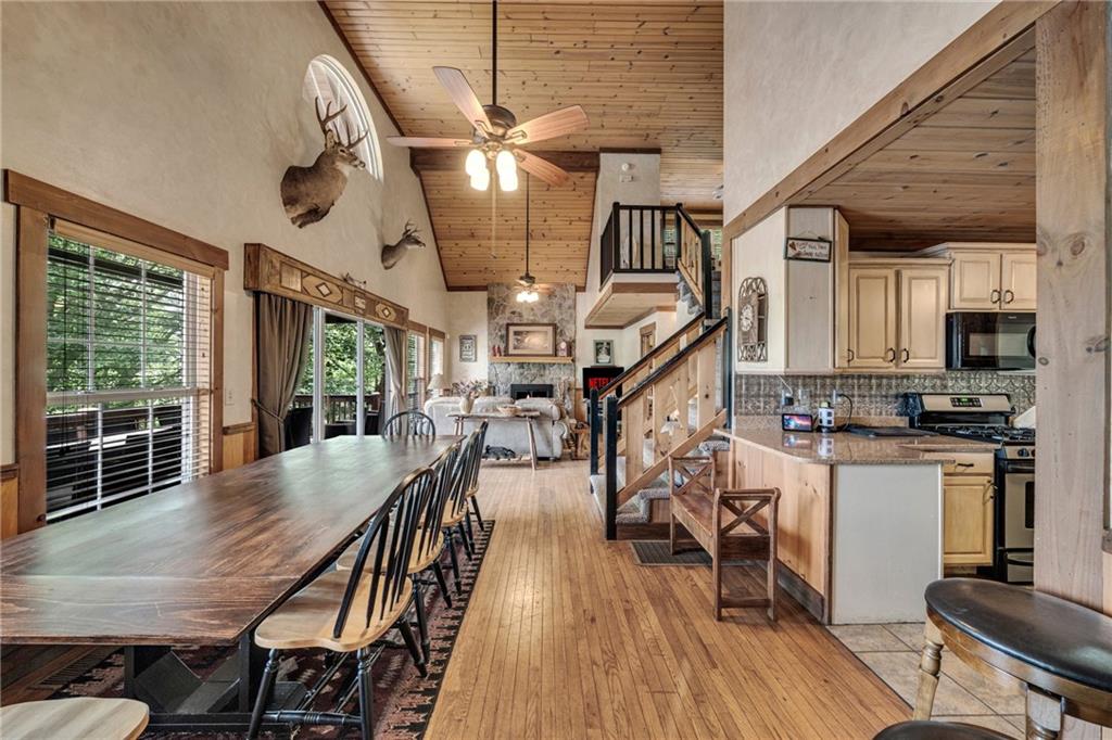 2003 Bend Of The River Road Hiawassee, GA 30546 - Photo 29 of 80 a view of a dining room with furniture window and wooden floor
