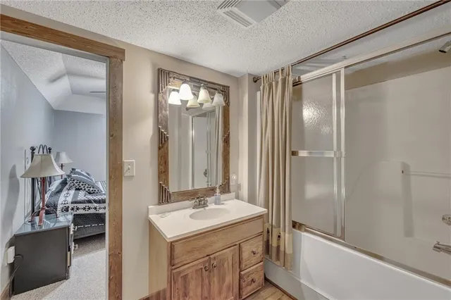 a living room with furniture a fireplace and a window