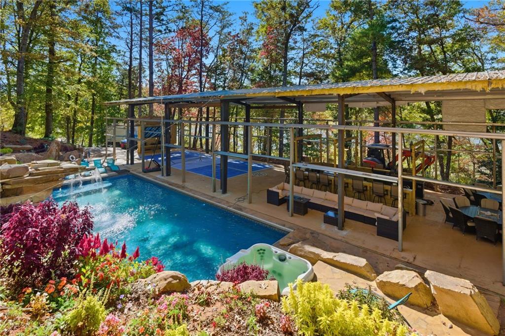 2003 Bend Of The River Road Hiawassee, GA 30546 - Photo 63 of 80 a view of a swimming pool with a lounge chair