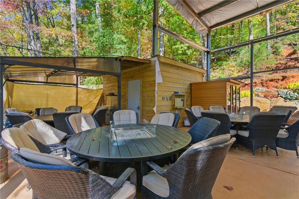 2003 Bend Of The River Road Hiawassee, GA 30546 - Photo 69 of 80 a outdoor dining space with furniture and wooden floor