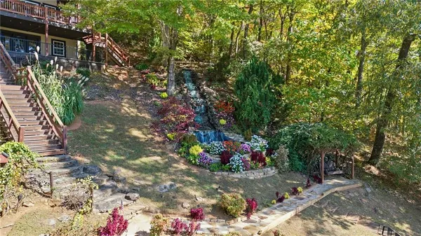 a view of a backyard with sitting area