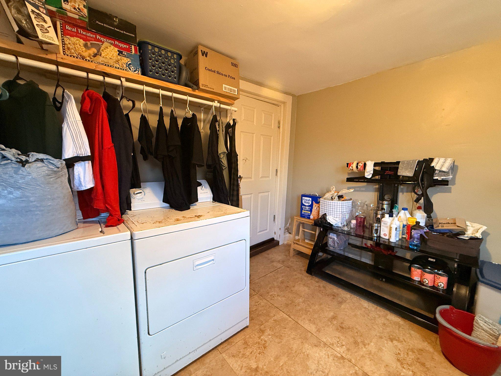 1003 Madison Street Chester, PA 19013 - Photo 14 of 30 a view of walk in closet with clothes and shoes