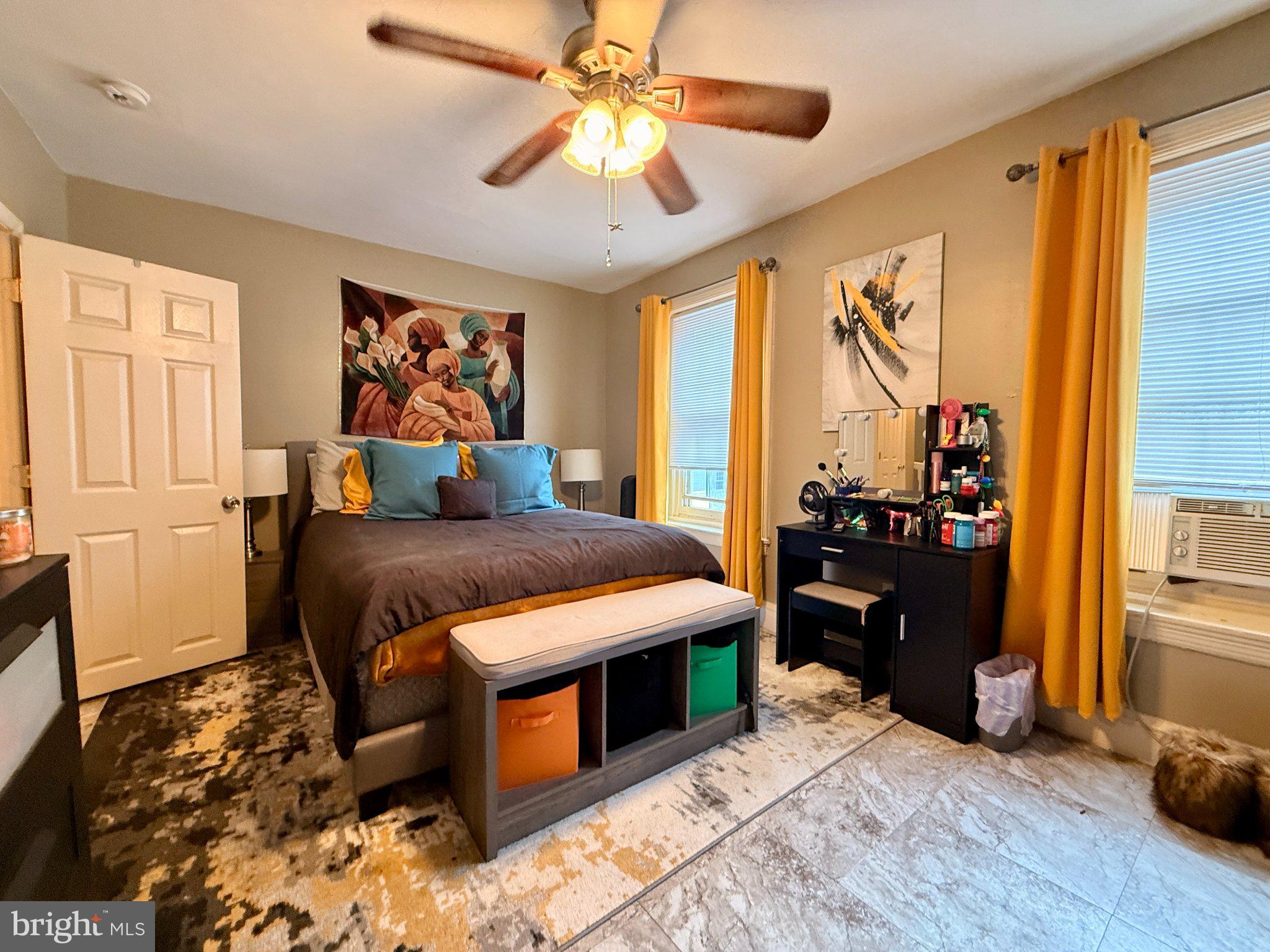 1003 Madison Street Chester, PA 19013 - Photo 15 of 30 a bedroom with a bed and a chandelier