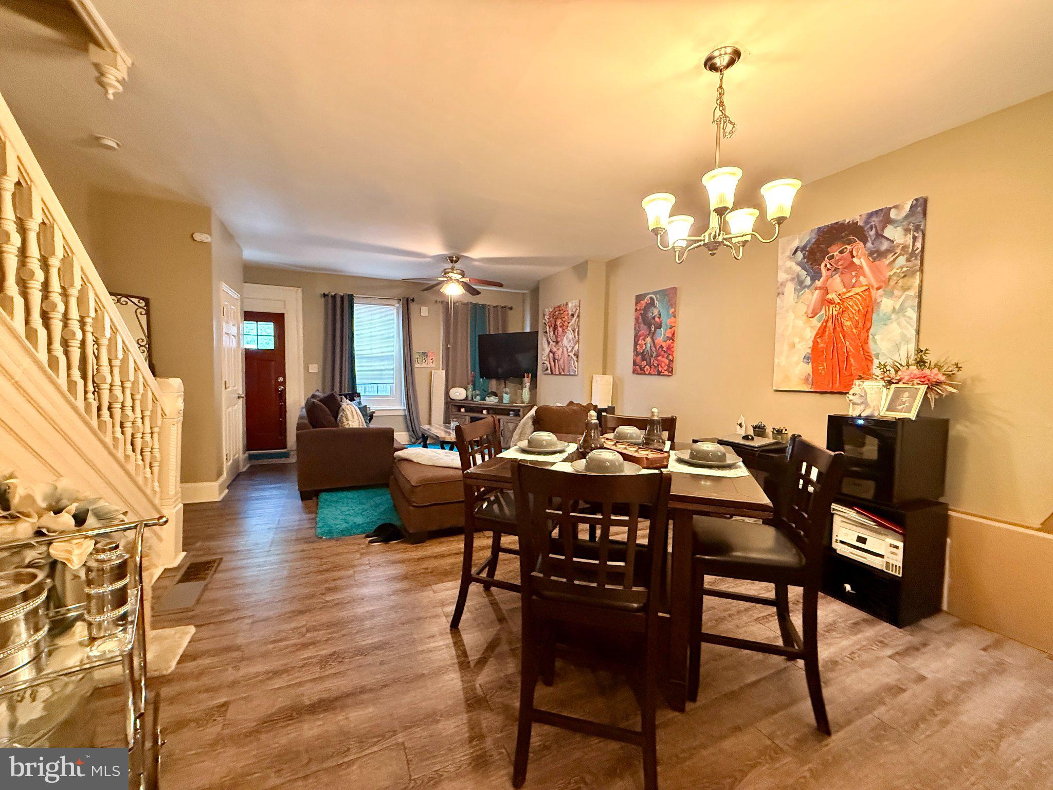 1003 Madison Street Chester, PA 19013 - Photo 2 of 30 a view of a dining room with furniture and wooden floor