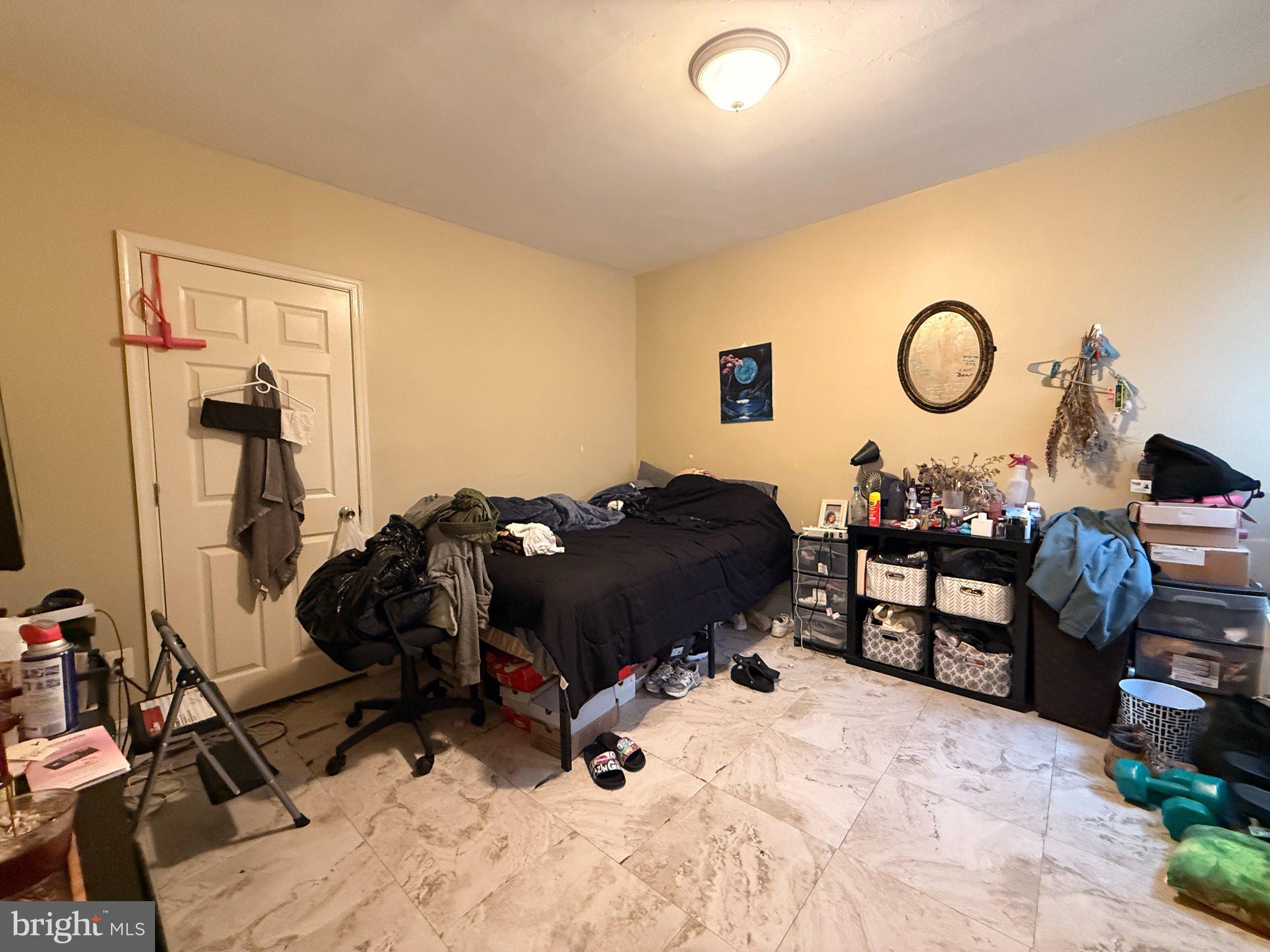 1003 Madison Street Chester, PA 19013 - Photo 22 of 30 a bed room with a bed and a chair