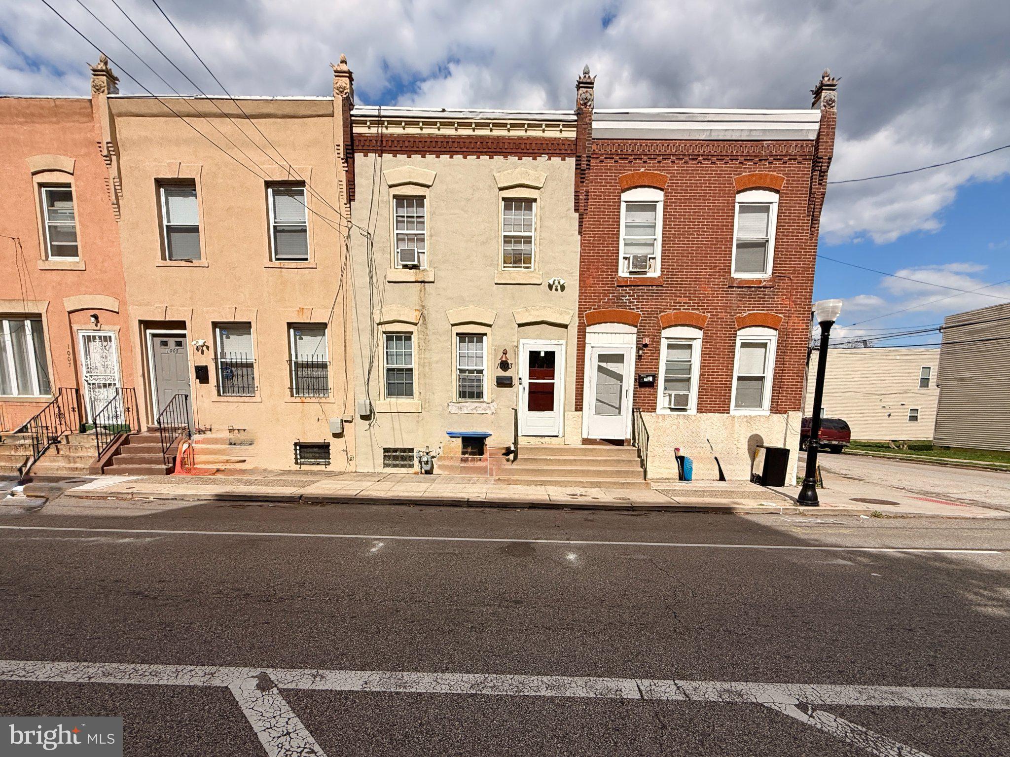 1003 Madison Street Chester, PA 19013 - Photo 28 of 30 a front view of a building with a street