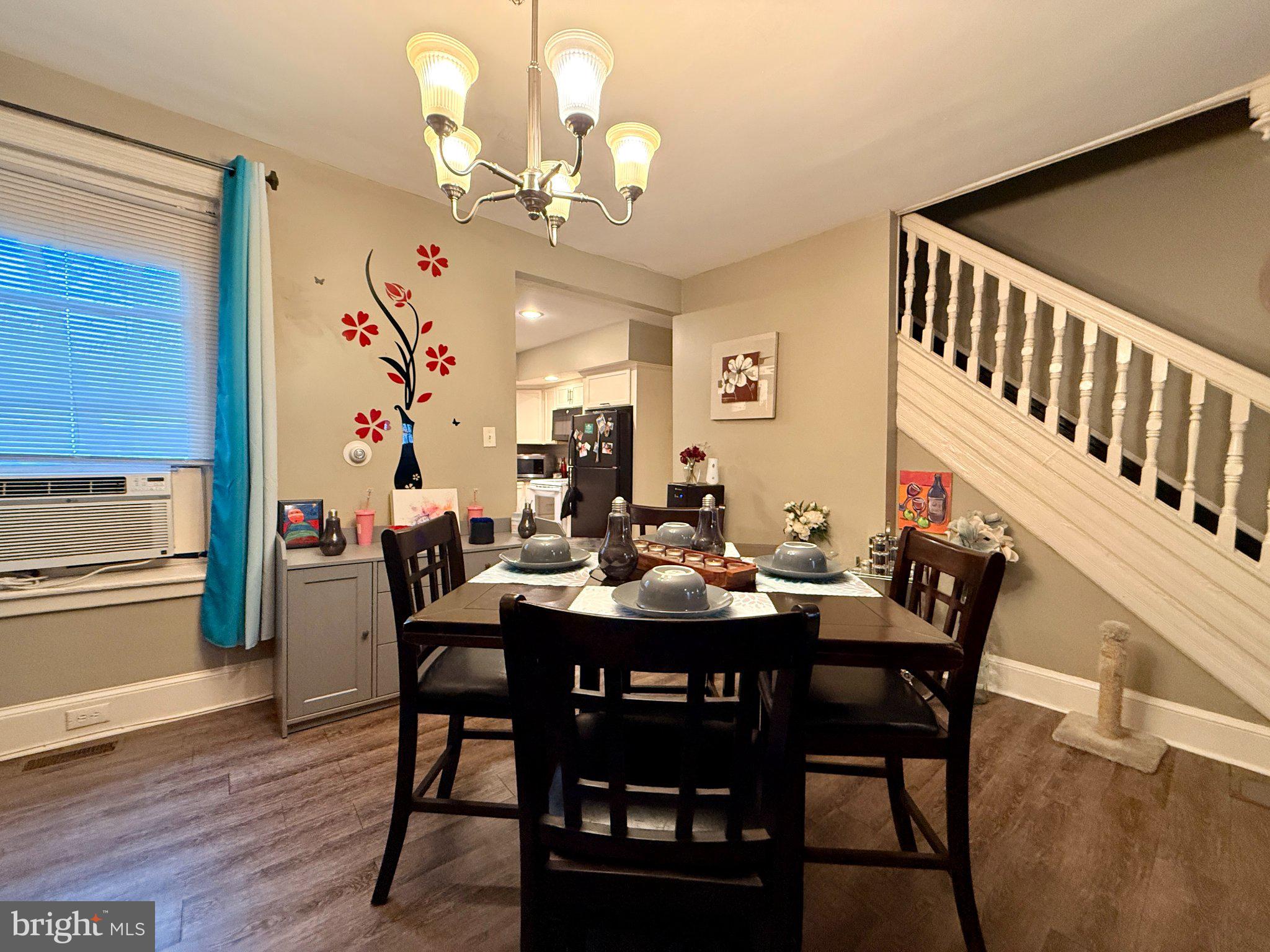 1003 Madison Street Chester, PA 19013 - Photo 4 of 30 a view of a dining room with furniture and wooden floor